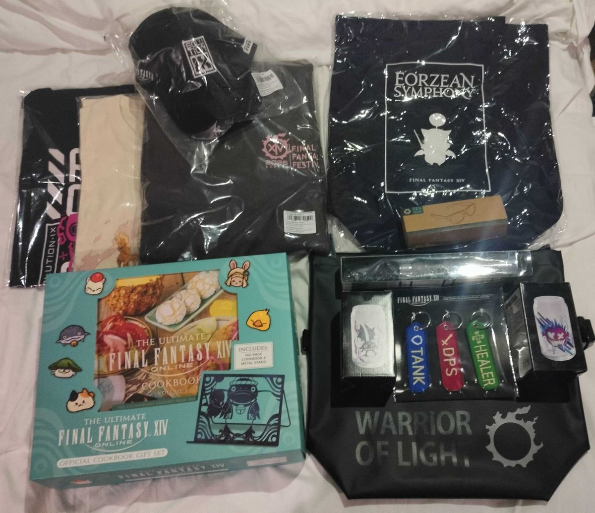FluffySyndicate's tweet photo. So one of the things I recently got to do was to go to Berlin for #FinalFantasyFanfest. Honestly didn't expect much but it was so fun. Here's a pic of all the merch I got. My wallet might cry but my soul sure is happy. I will never financially recover from this. #FFXIVFanfest https://t.co/Iq33EL7zfy