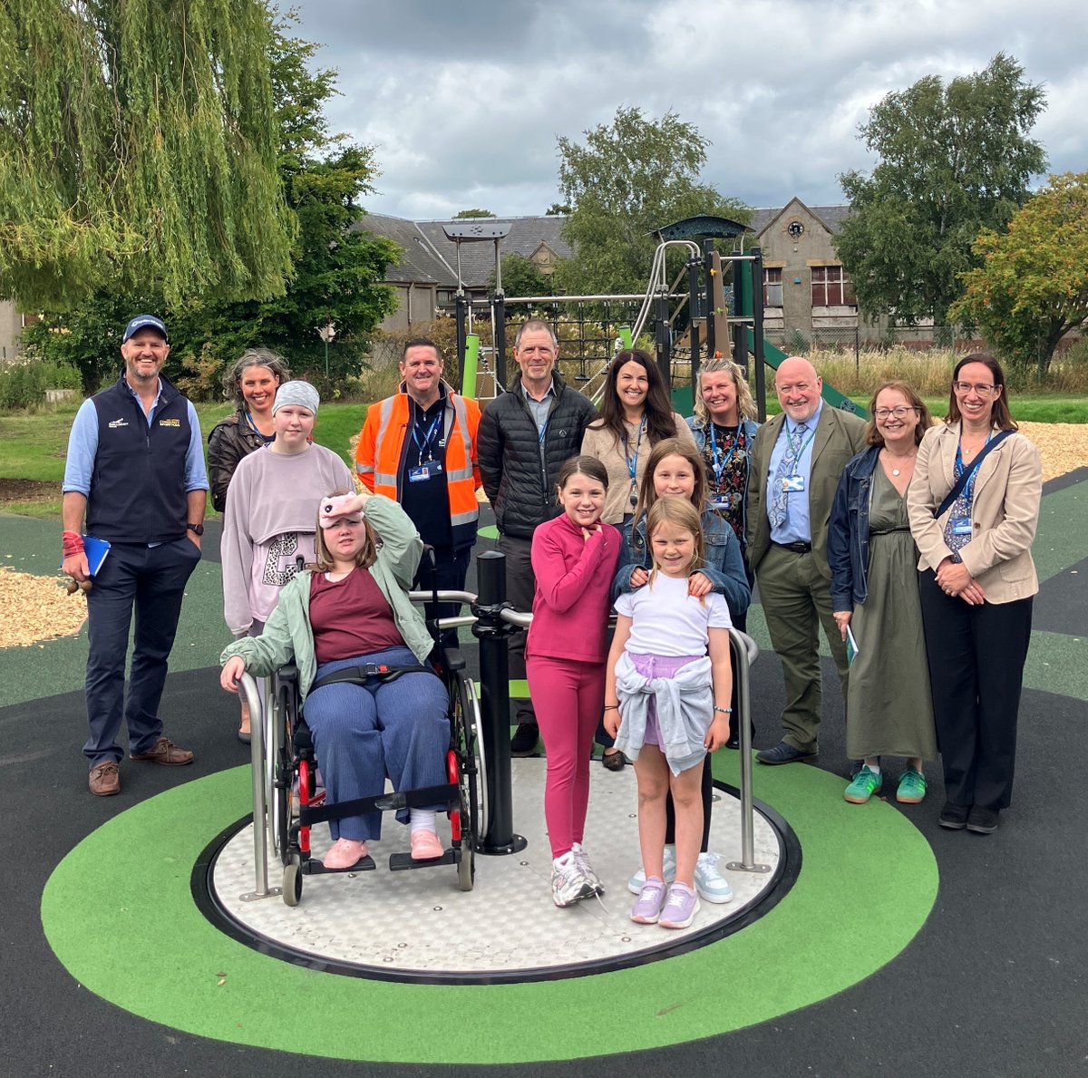 ELCouncil's tweet photo. Local children joined Cllr Colin McGinn and other representatives for the opening of a new play area in Tranent today (Wed, 5 Aug). The facility, which has been named the Crookston Willow Play Area, is located on greenspace off Lindores Drive. More info: https://t.co/3Ml7bWCorT https://t.co/2qgs6hxfNf