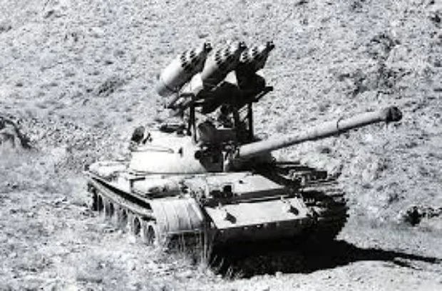 KrypTanko's tweet photo. Today’s “Odd Tank” is the Soviet ‘T-62 UB-32’

Built during the Soviet-Afghan war, which lasted from 1979-1989, this T-62 tank has been modified with three UB-32 rocket pods. The UB-32 rocket pod fires 57mm S-5 rockets which effectively turns tank into a Multiple-Launch Rocket system (MLRS).