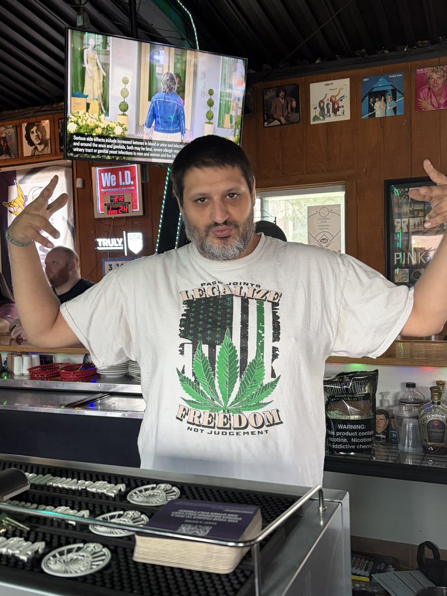 SkolCheryl's tweet photo. Dropped my grandson off and my car drove me here since it’s closer than home, but it IS Friday. Here’s Wally’s shirt of the day - cheers to the weekend🙂🍻 @MisfitsSaloon https://t.co/1kbgnVhBAp