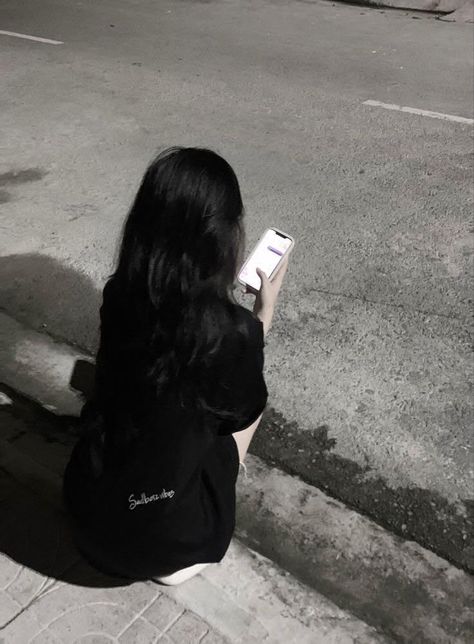 llarsonll's tweet photo. Late-night city vibes a quiet moment on the curb, eyes glued to the screen as streetlights glow
HHsH https://t.co/Us1JXdZoxW
