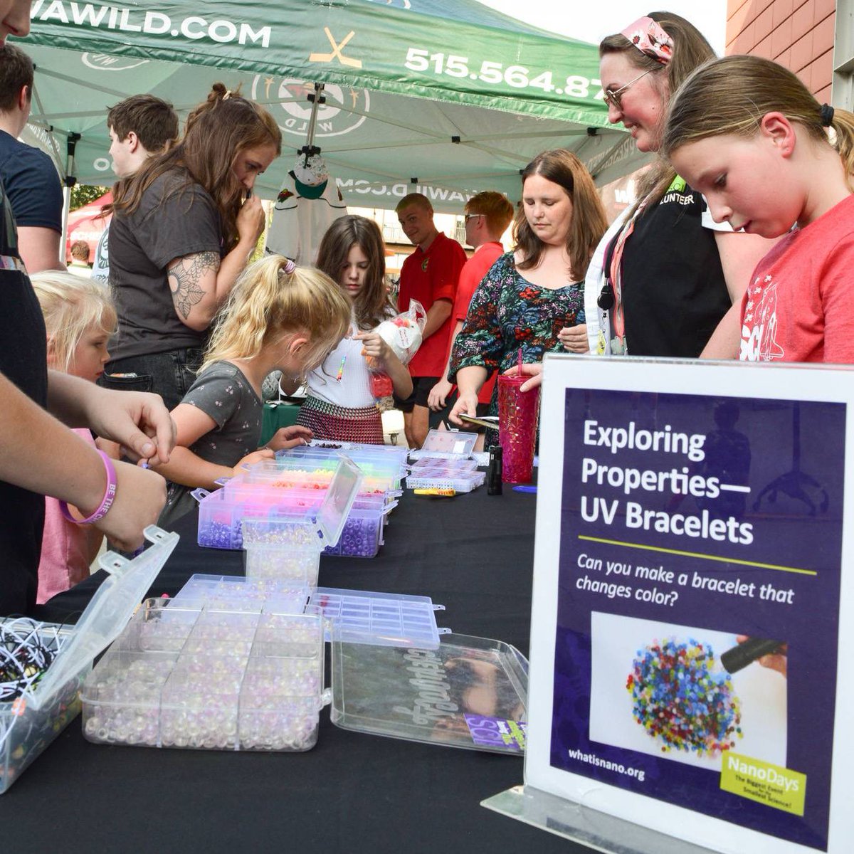 SCIOWA's tweet photo. We had a blast hosting the @IAWild Summer Block Party at the Science Center of Iowa! Families stopped by our booth to create colorful solar bead bracelets that change color in the sunlight, and even Crash got in on the fun by making his very own solar bead keychain! https://t.co/KKTciCwXWR