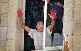 mishtal's tweet photo. This is Ramallah police station. The image captures the moment after a Palestinian mob lynched two Jews, and mutilated their bodies. Aziz Salha proudly shows his blood stained hands.

Ramallah is the city the Greens want to twin Manchester with. https://t.co/WdXOPxTpNP