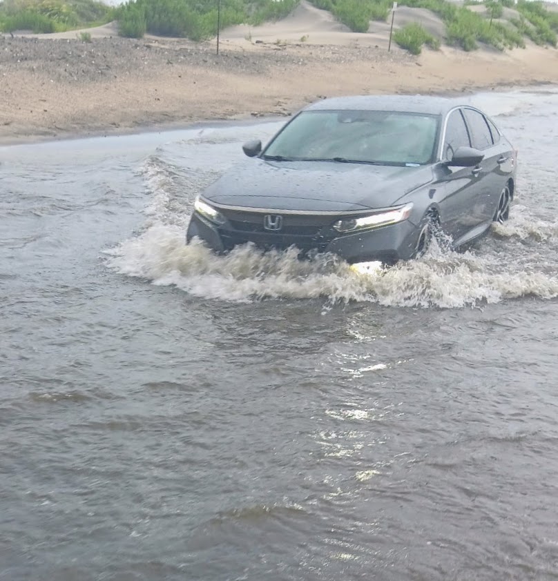 NCDOT_NC12's tweet photo. A couple of photos from earlier on Pea Island. NC12 remains CLOSED between the Basnight Bridge and Rodanthe due to deep standing water from intense rainfall. Some areas have received as much as seven inches of rain over the last 36 hours. #ncwx https://t.co/vzifzhutAG