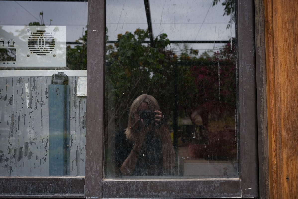 cbonneauimages's tweet photo. For part of the war and again for several weeks during the ceasefire, I lived alone in an abandoned hotel. The staff had fled the war zone, leaving me with the keys. The arrangement seemed implausible, almost allegorical: a functioning hotel emptied of guests, of service, of purpose. I shared it only with two dogs and a scattering of other animals that occupied the vacuum left by people.
Its isolation altered the hierarchy of sounds. At night, there were the hyenas laughing somewhere beyond the property, the frogs that had claimed the swimming pool, and, above everything else, the constant hum of the low-flying, armed Israeli drone. Around these persistent noises came the intermittent concussions of bombardment, the artillery shelling in the hills of Mansouri as the Israeli army advanced, and the sharper punctuation of drone strikes. The silence was never silence. 
The hotel acquired the atmosphere of a place that had outlived its own function. It felt less abandoned than suspended, as though waiting for an event that had already occurred. By day I left to work, always returning before dark because darkness belonged to other calculations. On some afternoons, the drones descended so low over the property that it seemed impossible not to imagine myself already incorporated into their field of vision. Surely the IDF knew I was there. 
The solitude gradually became ordinary. Ordinary enough that I planned to deliver a scheduled lecture to students at a Dutch university from that improbable refuge. I had set up my computer and was preparing to begin when a forced displacement order arrived. The lecture never happened. I left within minutes, frantically trying to pack and communicate with the professor at the same time. I did not return for several weeks.
A few days before I fled, I had photographed the hotel. At the time, I thought I was recording its strange, spectral atmosphere. Looking at the images now, it’s clear that they documented something else as well: the peculiar stillness that war sometimes produces, when abandonment itself becomes another form of occupation.