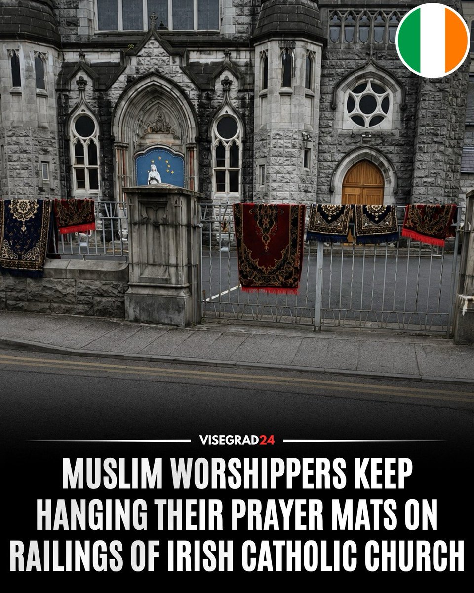 visegrad24's tweet photo. Muslim migrants keep hanging their prayer mats on the railings outside the Church of the Assumption in Tullamore, Co. Offaly, Ireland, despite repeated requests from locals over several weeks to remove them out of respect for the church. https://t.co/n3ADBXgzUr