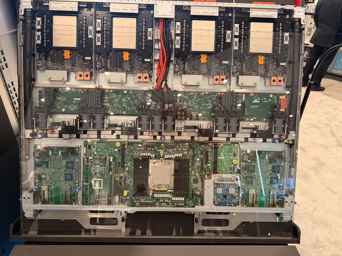BenBajarin's tweet photo. Meant to post some of these yesterday when I had some time on the floor at AMD event.  And of course I took some macros of companion silicon and analog chips :) 

MI450 and Compute/networking tray for Helios.  

I also got some commentary from execs on the Helios form factor design and why they went with a double wide.