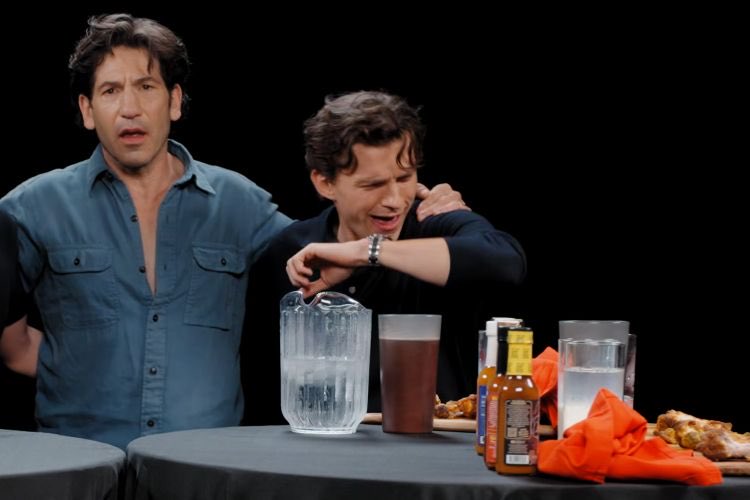 vsskyk's tweet photo. #TomHolland just became the #FIRST guest in #HotOnes history to throw up on camera after taking on the infamous spicy wings challenge. 😭🌶️ He laughed it off and joked that at least he didn’t get any on his Louis Vuitton outfit. https://t.co/2xmZ4s9sin