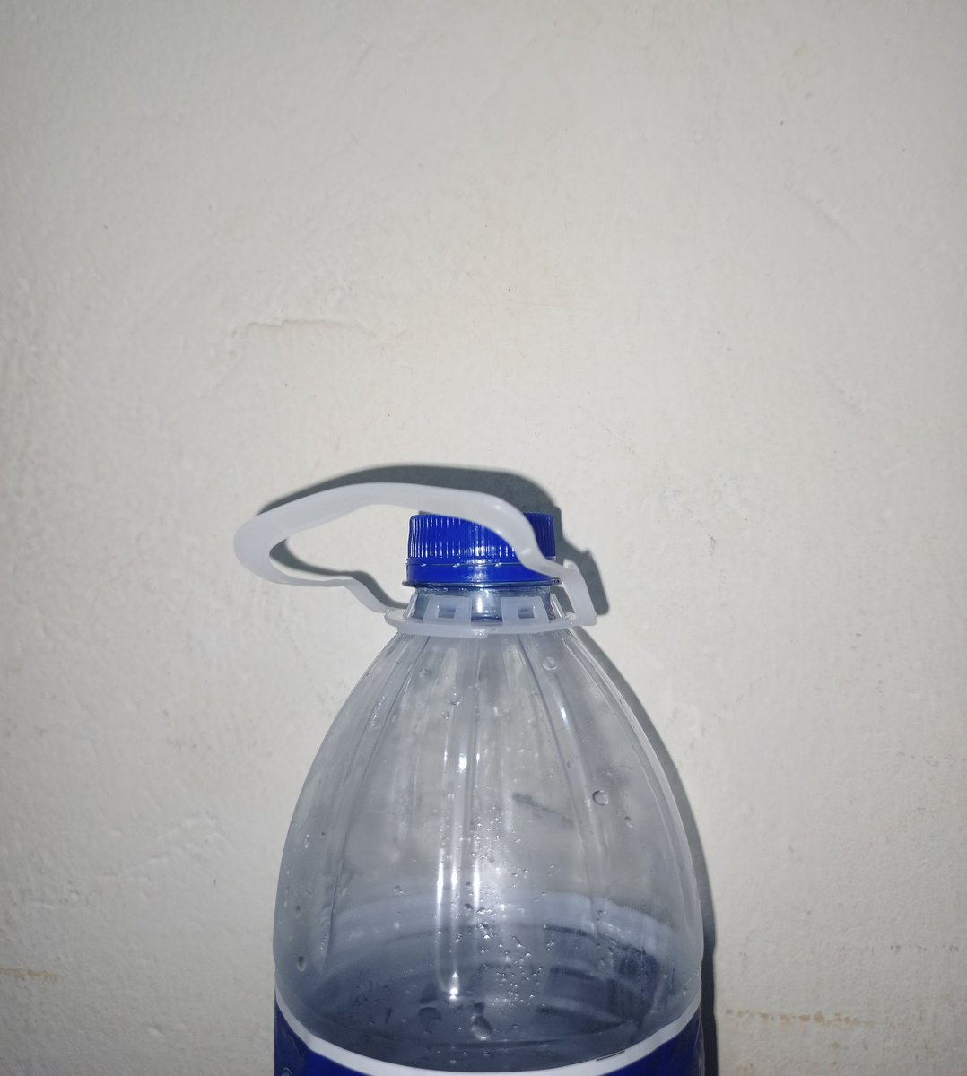 heisjoki's tweet photo. Whoever came up with the idea of putting handles on drinking water bottles is probably the reason shops no longer give out polythene bags. You ask for a bag, and the attendant just says, "You can lift your bottle by the handle". It's not funny either https://t.co/hcfM1k1F5W