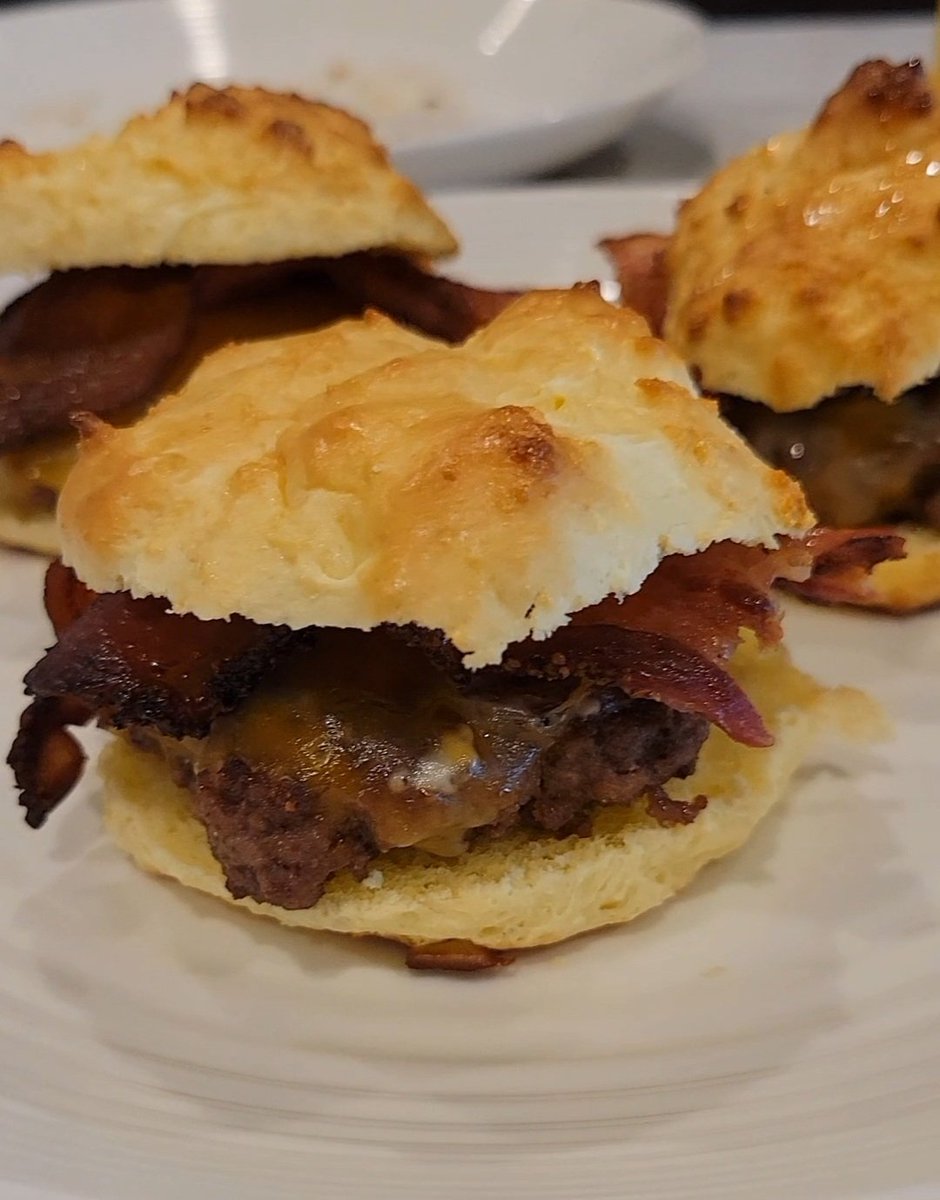 wilsonhlthcoach's tweet photo. My bacon cheeseburger sliders with buns made of powdered milk & eggs.

Been making these buns alot this year, especially for my daughter.

She still has no teeth and they're actually softer for her to eat than regular bread.

I like to use duck eggs, but chicken eggs are good too.

Yes, I added a slice of a 🍅 from my garden.

These little sliders were delicious! Paired them with some egg salad.

It was so satiating. Pretty sure I'm not going to eat again today 😊

Buns:
- 1.5 cups powdered milk
- 3 tsp baking powder
- 3 eggs

Mix well and set aside for 5min.
Preheat oven to 375°.
Place spoonfuls on cookie sheet lined with parchment paper.
Bake for 10-11min.