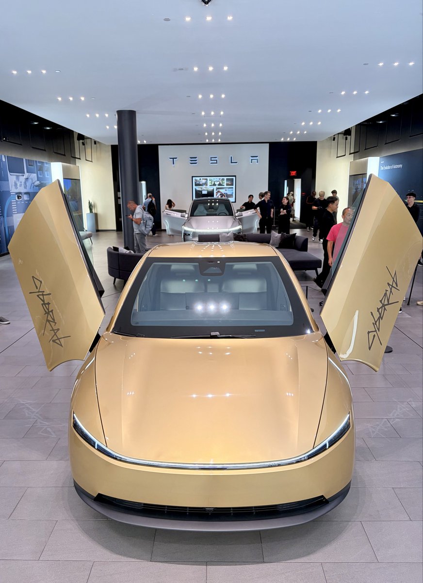 TechDrewX's tweet photo. Had a great time at Tesla’s newly renovated Santana Row showroom today! The place was packed with people experiencing the brand new Modle Y L for the first time, myself included! The middle row captains chairs feel great with plenty of room to enjoy a road trip even for a full sized adult like myself. My 9 year old son had tons of room in the 3rd row and really appreciated that he had side pillar vents back there.

We got to see the Cybercab today too! 😍 What a machine!! We were not allowed to get inside, but the helpful staff answered all of my questions and were able to open  and close the trunk and doors too. Can’t wait to get one of those in my garage!