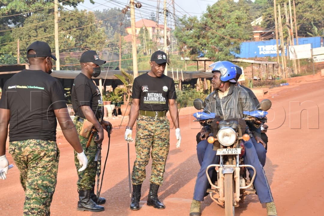 newvisionwire's tweet photo. UPDF personnel have intercepted a motorcycle that was found ferrying passengers during today's National Cleaning Day enforcement operations.

Authorities have urged the public to comply with the day's guidelines as the nationwide exercise continues.

#NationalCleaningDay #VisionUpdates
Photos by Simon Peter Tumwine