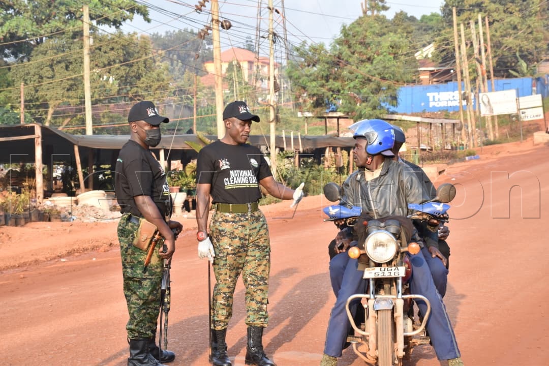 newvisionwire's tweet photo. UPDF personnel have intercepted a motorcycle that was found ferrying passengers during today's National Cleaning Day enforcement operations.

Authorities have urged the public to comply with the day's guidelines as the nationwide exercise continues.

#NationalCleaningDay #VisionUpdates
Photos by Simon Peter Tumwine