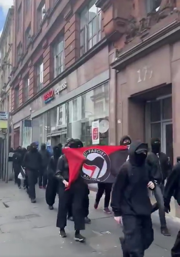 JacotheNorth's tweet photo. Enemies of the West march through Glasgow. (Masked of course.)

Later, they were confronted on Glasgow Green by locals who've had enough of them and what they represent.

Mounted police turned up - to protect Antifa and kettle the locals. Funny old world.
https://t.co/Ak7pqwWzWU https://t.co/g02AyJqjUY