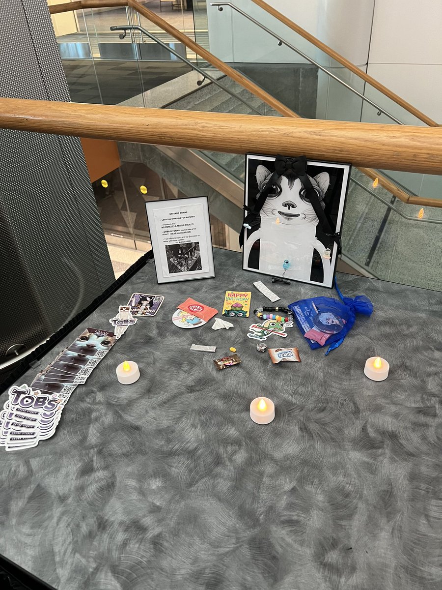 15digitlongname's tweet photo. The shrine is back 🙏 
Get more of those funny stickers for a small offering
(Very last table down the hall) https://t.co/6rvc1OWUQh