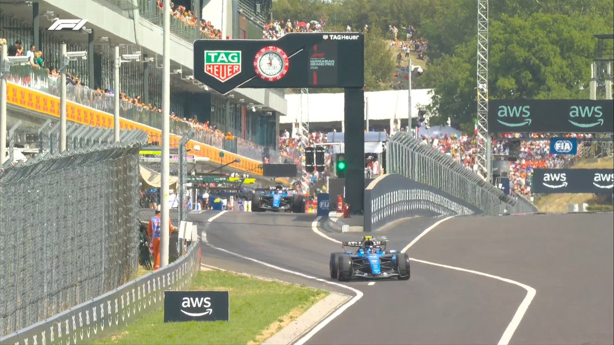 F1's tweet photo. 🟢 GREEN LIGHT IN THE PIT LANE 🟢

Williams are first out of the traps as qualifying gets under way at the Hungaroring! 🇭🇺

#F1 #HungarianGP https://t.co/nzfMvBGlAX