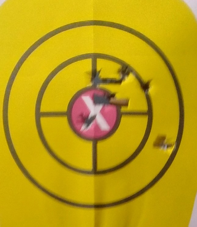 BuckCarterBand's tweet photo. Got the SR1911 back from shop yesterday and took it to the range. All shots within the white oval and the yellow circle are with it from 15 yards. That's pretty good for me. https://t.co/2WctD6dLAt