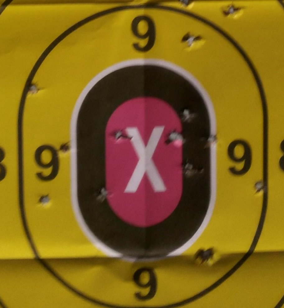 BuckCarterBand's tweet photo. Got the SR1911 back from shop yesterday and took it to the range. All shots within the white oval and the yellow circle are with it from 15 yards. That's pretty good for me. https://t.co/2WctD6dLAt