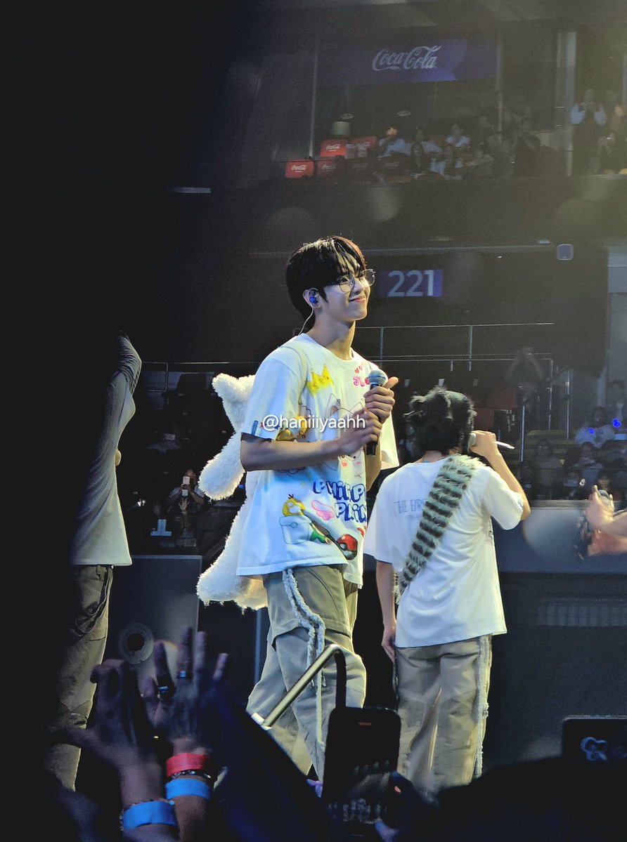 haniiiyaahh's tweet photo. i find this photo sooo endearing. there is so much happening around him, yet there he is, pausing for a moment in time, taking it all in, and smiling lovingly.

#AHOF   #아홉
#THE_FIRST_SPARK
#THE_FIRST_SPARK_IN_MANILA 💙🩵 https://t.co/KFeQRGMdmd