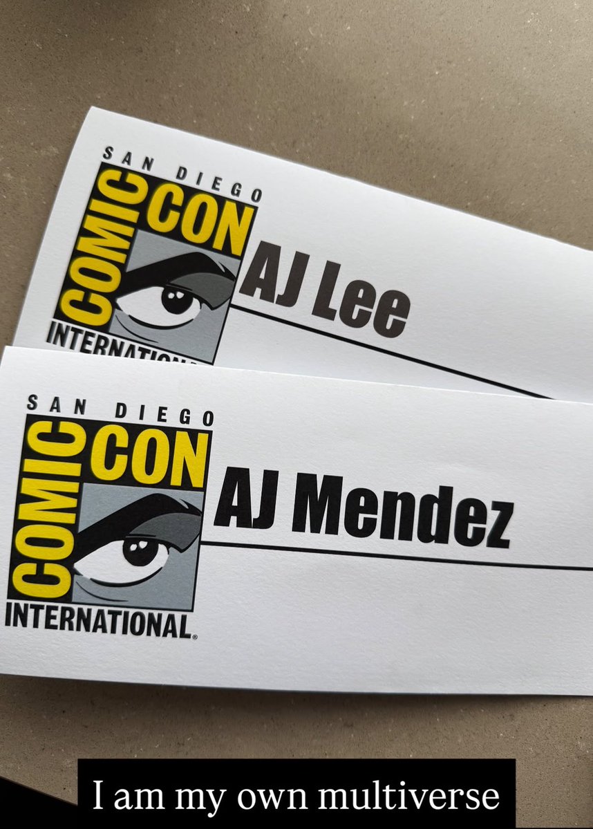 WrestlingWCC's tweet photo. AJ Lee with her two comic con nameplates 💀

“I am my own multiverse” https://t.co/qlyAoPwBJJ