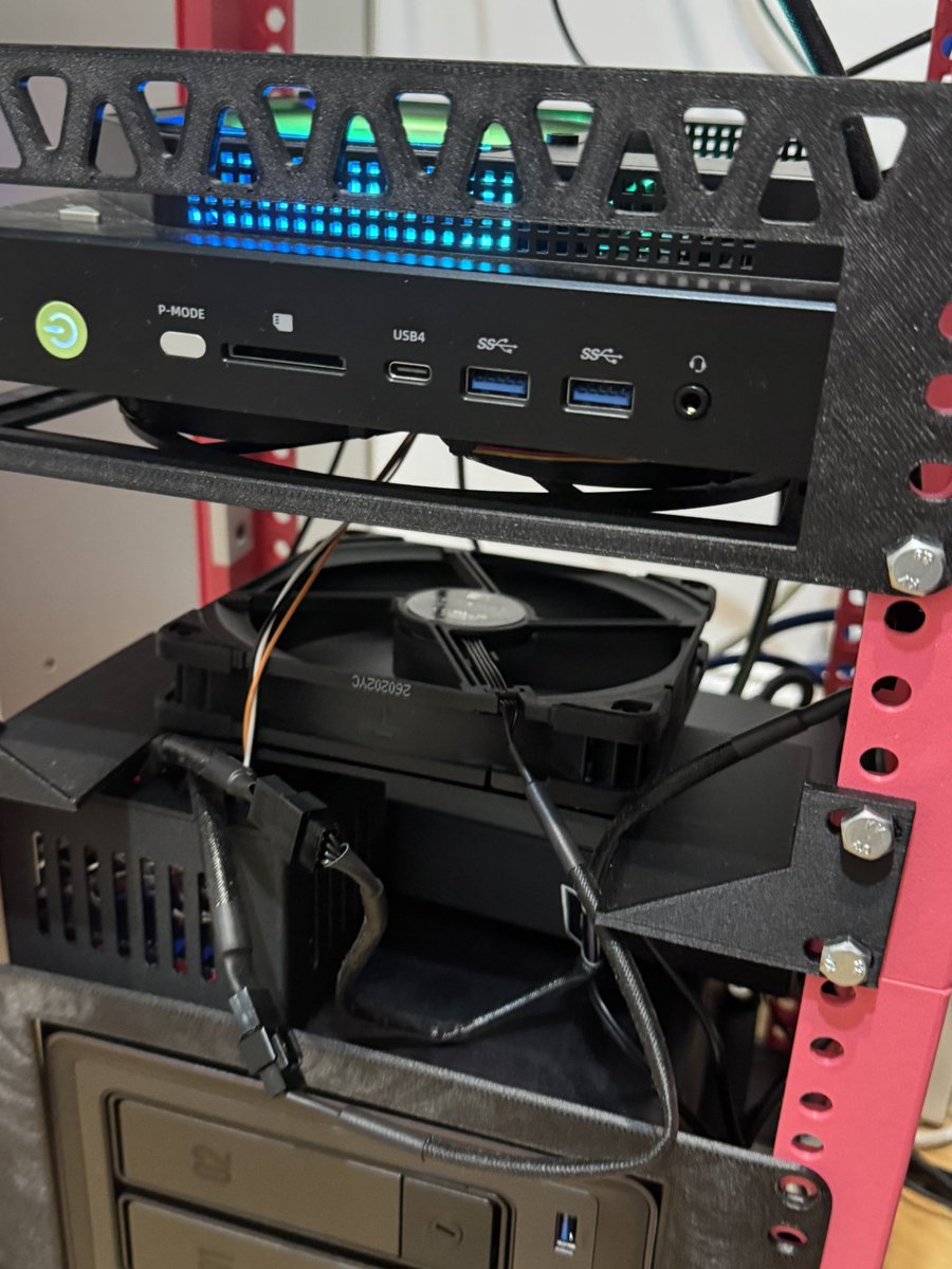 vanrohan776's tweet photo. Your office looks very interesting! I printed this labrax home lab for my local LLM server (128gb strix halo) and NAS. It was overheating during inference, so i got a temp sensor, esp32 and 2x Noctua fans and created my first "hardware" to auto cool down the homelab. Great feeling to create something like this, I'm thinking of my next hardware project now.