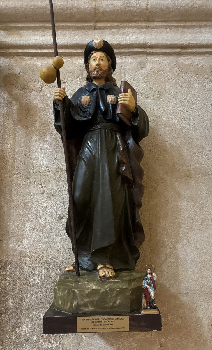 StRochRE's tweet photo. July 25: Feast of #StJames patron saint of #Spain Here’s St Roch and his wee dog 🐕 standing at the statue of St James the Apostle, in the beautiful basilica of Santa Maria in Alicante. @St_Rochs St James and St Roch, pray for us 🙏🏼 ✝️ https://t.co/D6NkeFOvO9