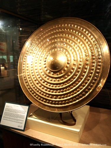 GaelicFuturist's tweet photo. A Bronze shield known as the Sun Shield discovered in Lough Gur, Limerick dating to around 1000 B.C.

Measuring 71cm across, it began life as a flat sheet of bronze, which was then hammered over rounded shapes to produce the reflective circles. https://t.co/tZ31LpgP2z