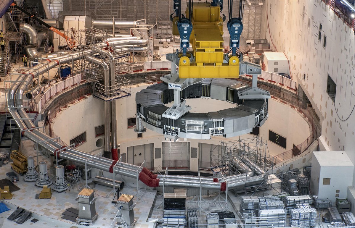 Kisalay_'s tweet photo. Tokamaks, the doughnut-shaped devices that currently lead magnetic fusion

A star burns without walls. On Earth we must invent them.

The tokamak is a hollow doughnut of vacuum filled with a plasma hotter than the core of the sun and held aloft by pure magnetic force. Strong toroidal field coils run the long way around the ring and create the primary magnetic cage. 

A massive current driven through the plasma itself generates a second poloidal field. Together the two fields twist into helical field lines that particles follow for kilometres without ever striking a solid surface.

This geometry was first perfected in the Soviet Union more than sixty years ago and remains the most successful magnetic confinement concept ever built. 

The plasma can reach temperatures of one hundred and fifty million degrees while densities climb high enough for deuterium and tritium nuclei to overcome their mutual repulsion and fuse. Each fusion reaction releases a helium nucleus and a neutron that carries most of the energy.

Machines such as JET have already produced tens of megajoules of fusion energy in short pulses. ITER now under assembly in France, is designed to produce ten times more power than it consumes for sustained periods. 

Private efforts are racing ahead with high field magnets made from rare earth barium copper oxide superconductors that allow smaller devices to reach the same conditions with far less stored energy.

The challenges remain severe. Plasma instabilities can grow in microseconds and dump their heat onto the walls. Materials must survive neutron bombardment for years. Yet every major record in magnetic fusion has been set inside a tokamak. The shape that once seemed merely convenient has become the workhorse of the entire field.

If fusion power ever lights cities, it will most likely first emerge from a glowing ring of plasma suspended inside a carefully engineered doughnut of steel and magnets.