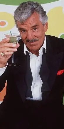 MrPitbull07's tweet photo. On July 22, 2013, Dennis Farina died at 69 in a Scottsdale, Arizona hospital from a pulmonary embolism. 

The actor famous for playing cops and mobsters had spent 18 years carrying a real Chicago police badge.

Long before Hollywood knew his face...

Chicago knew his badge.

Born on February 29, 1944, Farina was the youngest of seven children growing up in the city's Old Town neighborhood.

His father was a neighborhood doctor who sometimes accepted groceries instead of money.

Young Dennis tagged along on those house calls.

He watched wounds being stitched, injections being given, and jokes shared in the middle of difficult days.

That mix of grit, humor, and loyalty never left him.

After serving three years in the Army, he joined the Chicago Police Department in 1967.

He worked patrol.

Then became a detective.

The job wasn't glamorous.

Fellow officers even joked about his shooting skills, calling him "The Great Wounder."

But policing taught him something far more valuable.

How fear sounded.

How real authority entered a room.

How danger often hid behind ordinary conversations.

His second career arrived by accident.

Director Michael Mann came to Chicago while preparing *Thief* and wanted people who understood real police work.

Farina started as a consultant.

Then stepped in front of the camera.

Even after filming, he went back to detective duty.

For years, the badge and acting career existed side by side.

Mann later cast him in *Miami Vice*, then *Manhunter*.

Finally came *Crime Story*.

As Lieutenant Mike Torello, Farina wasn't pretending to be a detective.

He already was one.

Viewers believed every glance.

Every pause.

Every command.

Hollywood soon discovered something else.

The tough cop could be incredibly funny.

Whether terrifying henchmen in *Midnight Run* or exploding with frustration in *Get Shorty*, Farina made danger entertaining.

He refused to play the same role forever.

"I think the idea of acting is to spread your wings."

And he did.

From *Saving Private Ryan* to *Out of Sight*, *Snatch*, *Sidewalks of New York*, and finally *Law & Order*, every role carried the same unmistakable presence.

Off screen, he never drifted far from Chicago.

He stayed close to old police friends and shared 35 years with Marianne Cahill.

He was also the father of three sons and grandfather to six grandchildren.

Farina believed Chicago shaped everything about him.

And it showed.

The badge made him believable.

Life made him unforgettable.
