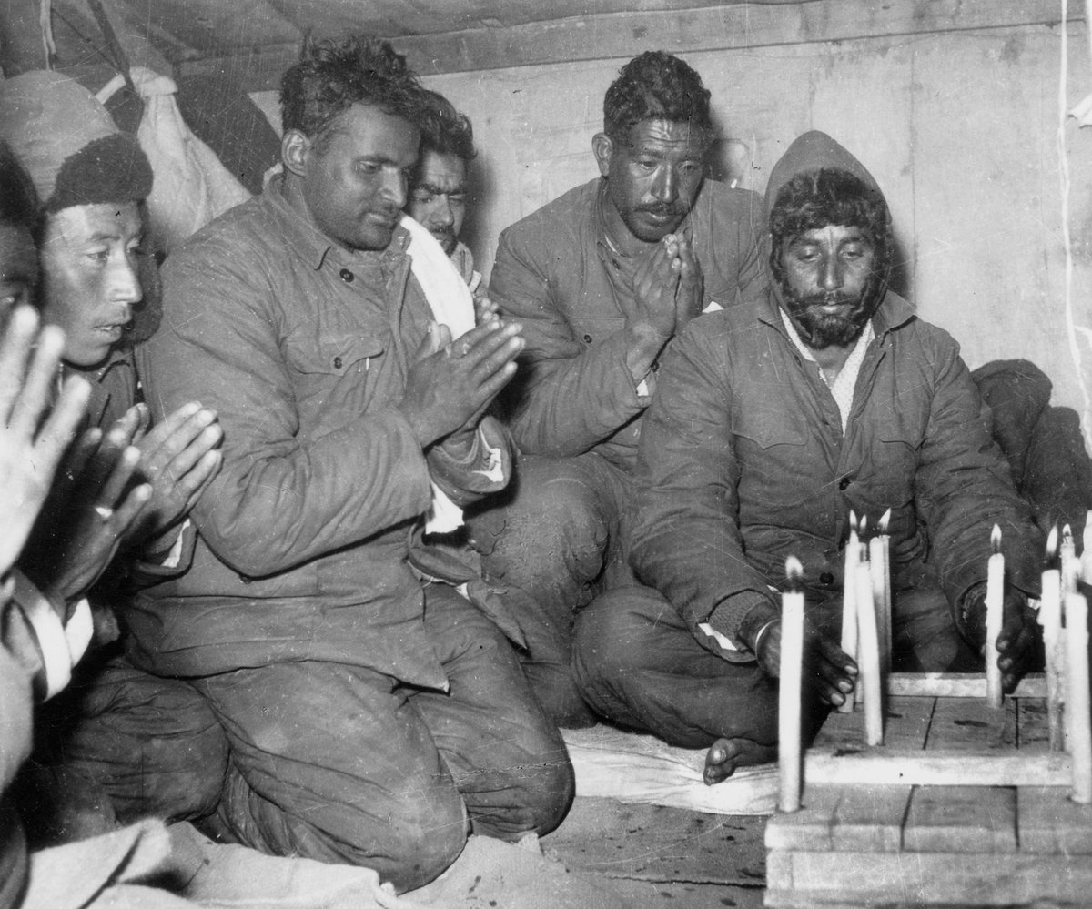 jai_samota's tweet photo. A story of faith and belief

Major (later Lt Col) Dhan Singh Thapa, the Paramvir Chakra awardee when captured by the Chinese in 1962, his time spent as a prisoner of war was not extensively discussed. When he was imprisoned by the Chinese troops, he had discovered a long stone that he prayed to. He was certain that it was because of Lord Shiva he was able to endure anything because of that. In fact, Major (later Lt Col) Srikant Hasabnis of 5 Jat, a prisoner in the same military camp, communicated with Lt Col Thapa's family about their ordeal.
When the Chinese soldiers entered and one interrogator asked him, "Who are you praying to?" Major Thapa was worshipping to lord Shiva on the stone he had discovered. My God replied Major Thapa. The interrogator then asserted that your Gods are untrue. My God is always with me Major Thapa said in a bold tone as he slipped off his jacket. Even if you shoot me, he will have to save me, but I will live. I survived because my God wanted me to live even though hundreds of your soldiers were unable to kill me. Major Hasabnis had told him afterwards. Major Thapa, wear your jacket; you never know when these Chinese might shoot you.

Attached is photograph of Indian Troops praying in a Chinese PoW camp.