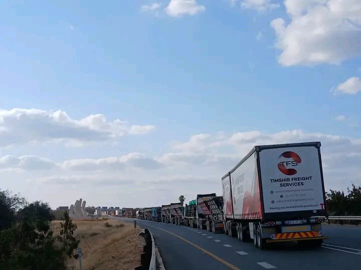 Abramjee's tweet photo. UPDATE ON TRUCK CONGESTION ON THE CORRIDOR TOWARDS BEITBRIDGE PORT OF ENTRY

The Commissioner of the Border Management Authority (BMA), Dr Michael Masiapato is aware of the long queues of freight trucks on the corridor leading to the Beitbridge Port of Entry.

The BMA and the South African Revenue Services (SARS) wish to clarify that the current delays are not caused by operations on the South African side of the border. 

All  SARS and BMA functions, including immigration processing, agriculture inspections, port health services and biosecurity controls, are operating efficiently, with systems functioning normally.

The congestion is being experienced on the Zimbabwean side of the border. 

According to information received from the Zimbabwean authorities, limited parking capacity at their port is contributing to the delays. 

A significant number of abnormal-load vehicles are occupying available parking space, reducing the port's capacity to receive additional freight trucks. 

Furthermore, processing by clearing agents on the Zimbabwean side is taking longer than usual, which has slowed the movement of cargo across the border.

The BMA is actively engaging its counterparts in Zimbabwe to identify and implement measures that will expedite the movement of trucks and alleviate the congestion.

The BMA appreciates the patience and cooperation of transport operators, freight companies and motorists, and will continue to provide updates as the situation develops.

*Operation HI-TIVISE*
Report illegal activities by calling 0801 229 019. "If you see something, say something."
Illegal activities can also be reported online through the BMA website.
