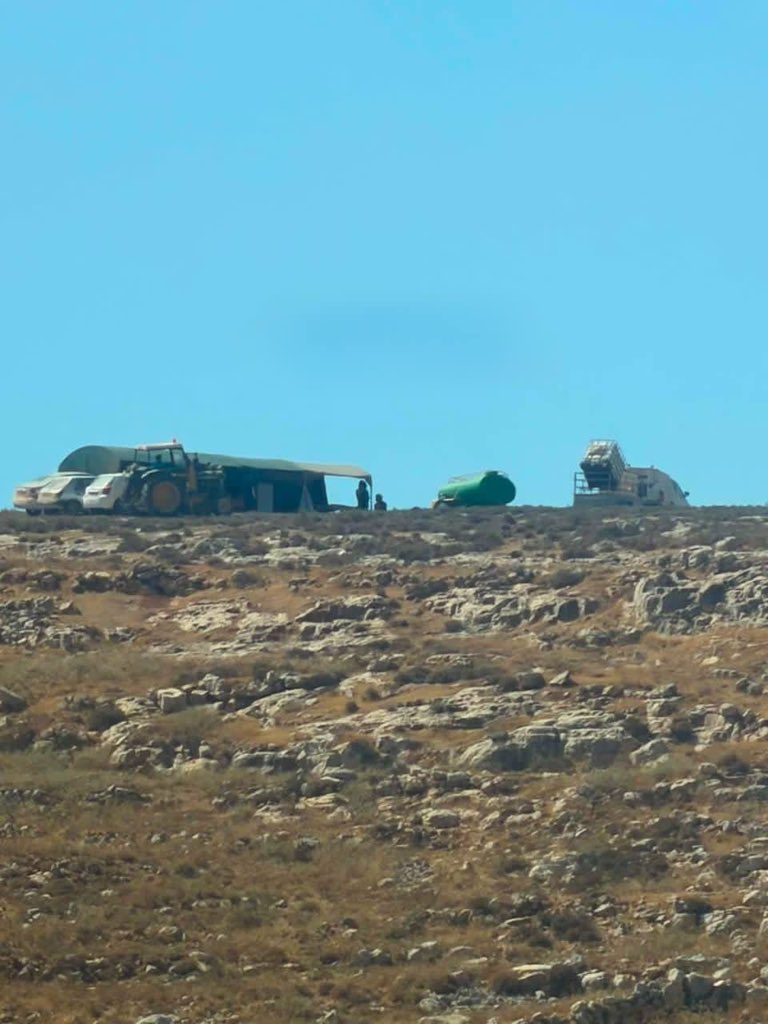 zionist jewish settlers, protected by the Israeli occupation forces, set up new