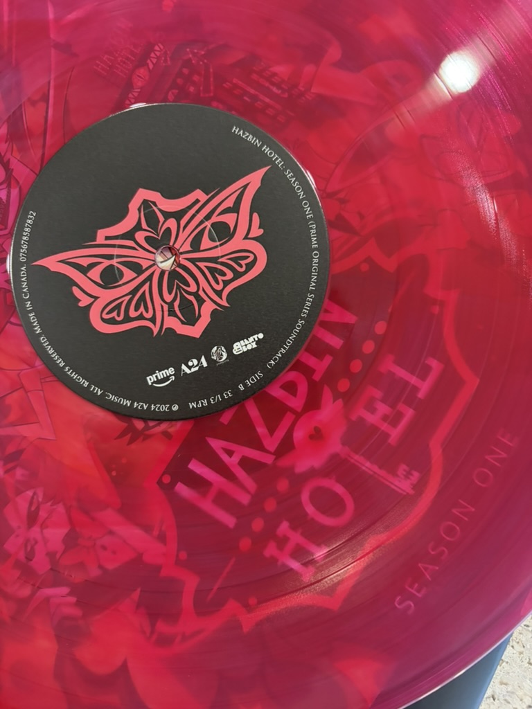 Evil_Cultist's tweet photo. It's surprising to see that the season one Vinyl for Hazbin Hotel features Valentino's symbol! I guess this proves he's the real protagonist! #sdcc #valentinohazbin #hazbinhotel https://t.co/xwfSGNZhjN