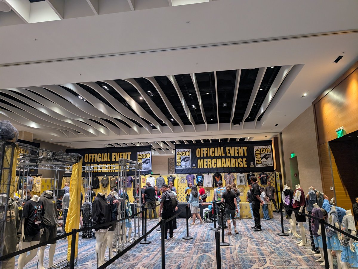 SpectorKate's tweet photo. The Marriot merch store has a great setup where you can see all the items! Almost no wait, but they're out of a lot of things. Free online shipping right now though!  @SD_Comic_Con #SDCCMerch #waitedtoolong https://t.co/l1O5QyTOoC