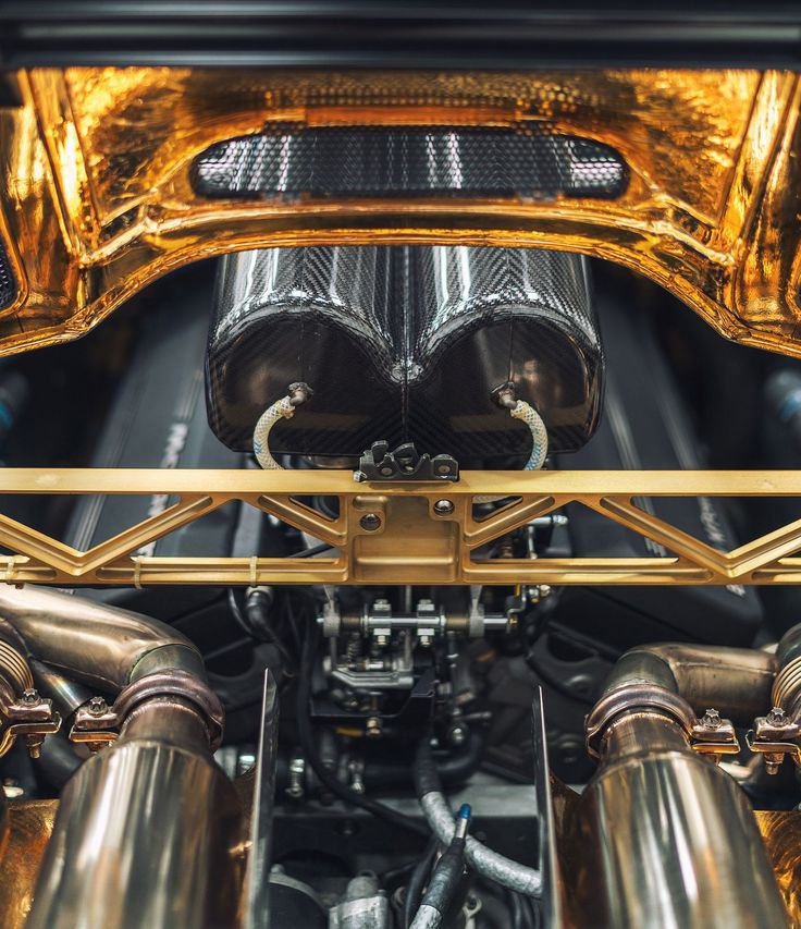 Timeless_Vis's tweet photo. To protect the engine bay from extreme heat, McLaren engineers lined the entire exhaust compartment with a layer of pure 24-karat gold foil for optimal thermal insulation. https://t.co/uXe0BD3nsQ