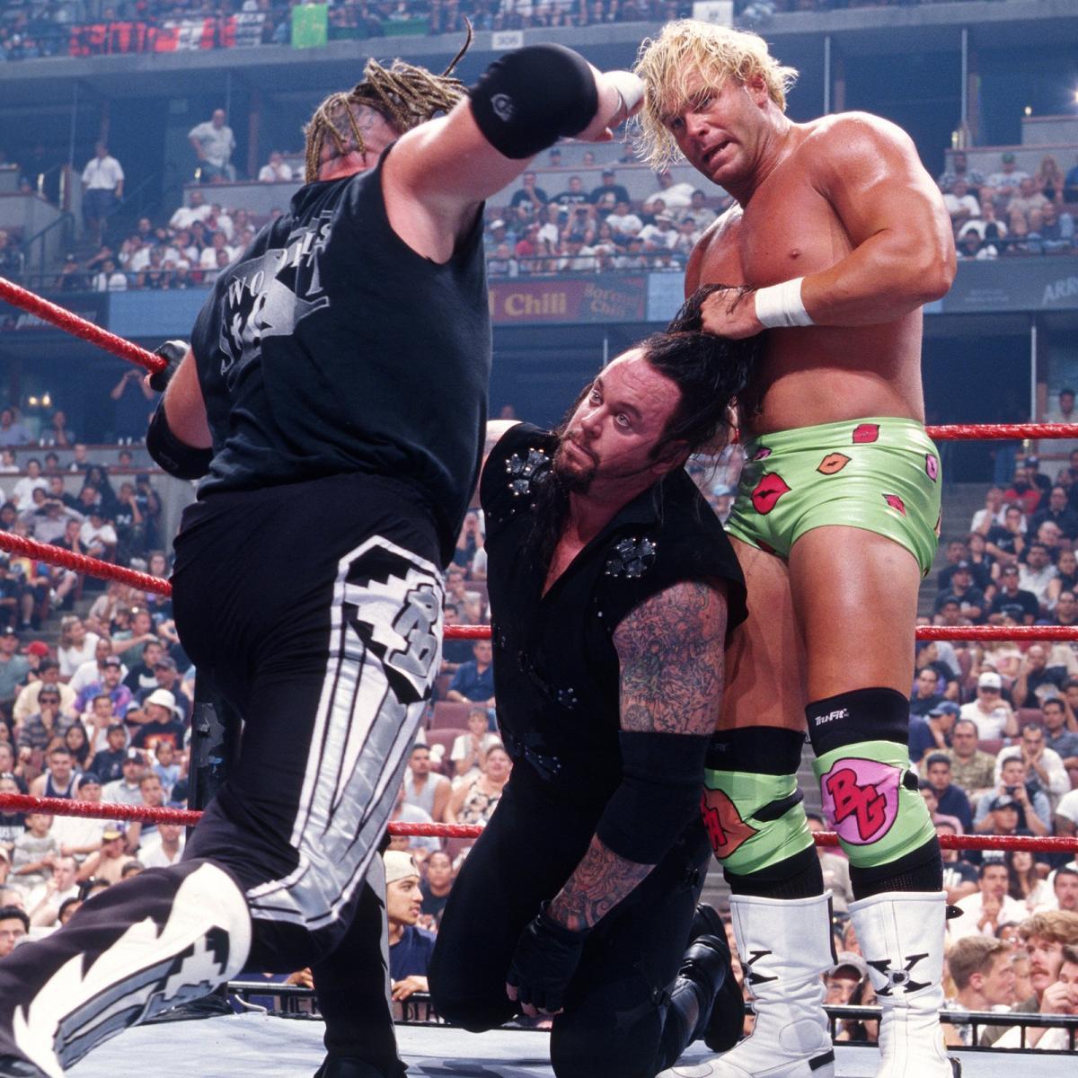 WWFWrestling1's tweet photo. πΈ Shot from this day in 1998: Undertaker & Steve Austin defended their tag team titles against the New Age Outlaws. #WWF #WWERaw #BillyGunn #RoadDogg #Undertaker #SteveAustin https://t.co/loxJe2m9X9