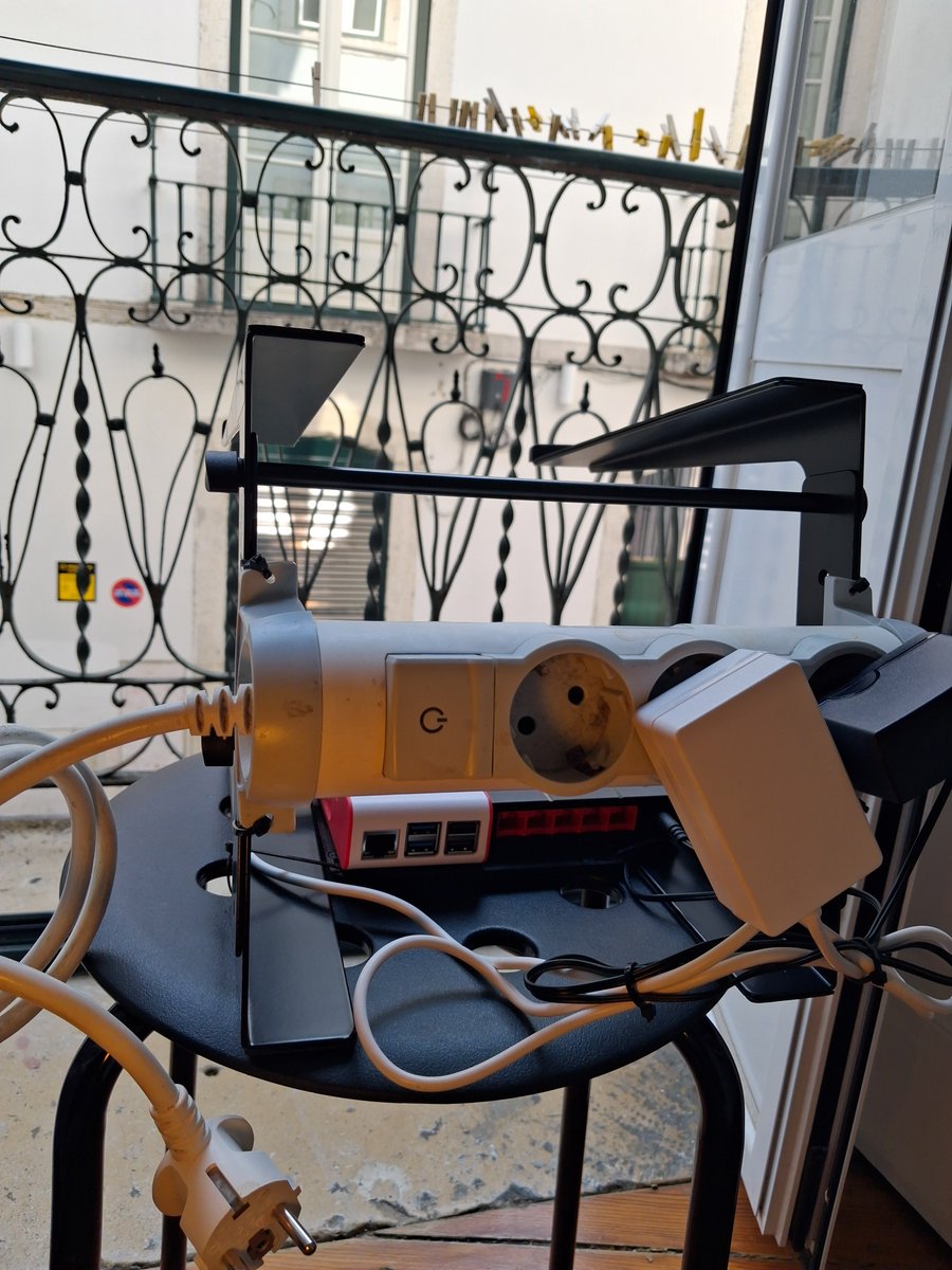 Superdido13's tweet photo. Pi + switch mounted, power secured, cables running — improvised with a DJ stand. Still waiting on the cable-making kit, a new router, and eventually a mini PC for NAS storage before this is fully wired up. 

#SuperDiDzero #PCBuildPT #Portugal #HomeLab #RaspberryPi https://t.co/rOaDKM8Dqe