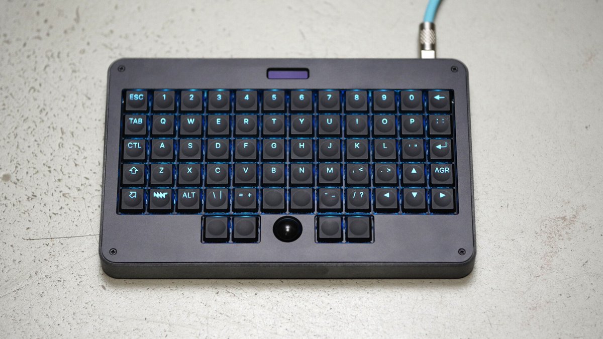 stufflistings's tweet photo. This compact keyboard comes with a built-in trackball.

Integrated cursor navigation and mouse controls, designed as an all-in-one input device for working on the move.

The E169 Portable Mechanical Keyboard... https://t.co/KsSBL8EsFy
