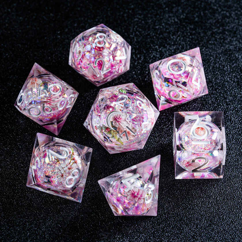 urwizards's tweet photo. A tiny spring spell sealed inside every die. 
Sakura liquid core dice with floating petals, soft shimmer, and a roll that feels like cherry blossoms caught in magic.

#dnddice #ttrpgdice #dicegoblin #liquidcoredice #sakuradice #dungeonsanddragons #dicecollection https://t.co/7qkND4mvOv