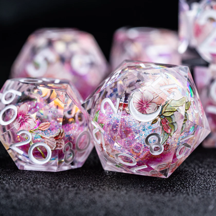 urwizards's tweet photo. A tiny spring spell sealed inside every die. 
Sakura liquid core dice with floating petals, soft shimmer, and a roll that feels like cherry blossoms caught in magic.

#dnddice #ttrpgdice #dicegoblin #liquidcoredice #sakuradice #dungeonsanddragons #dicecollection https://t.co/7qkND4mvOv