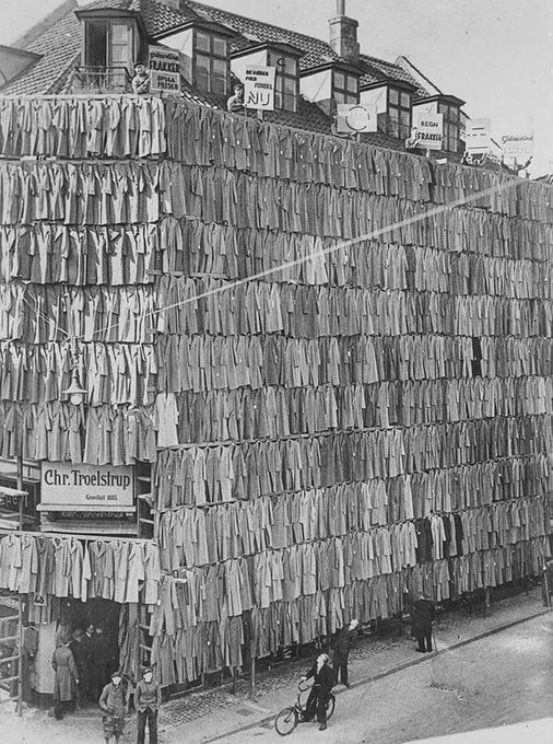 Rainmaker1973's tweet photo. In 1936, Danish clothier Christian Troelstrup covered his five-storey store building with coats to attract buyers. https://t.co/O62kyw70Ve