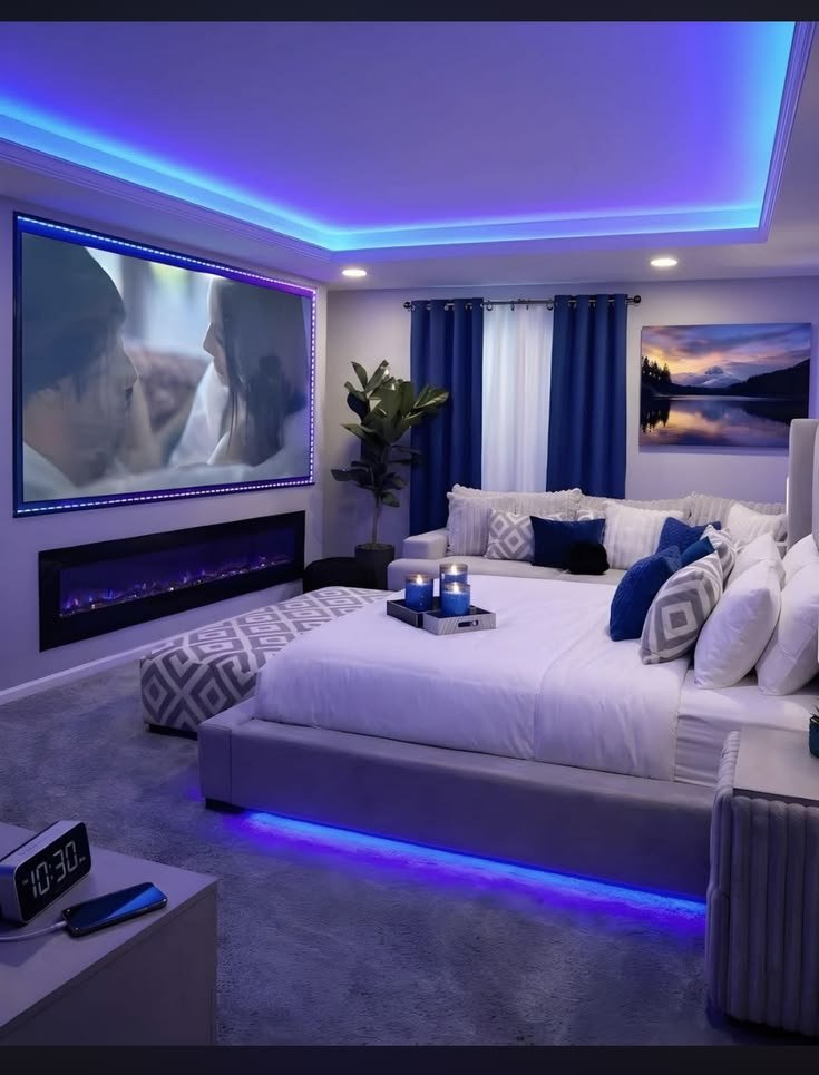 Sirsayso1's tweet photo. Turning my room into a private theater was the best decision.  
White bedding, royal blue accents, LED lights, and a movie on the big screen.  
10:30pm and I’m exactly where I need to be. https://t.co/7t8TYTdCD4