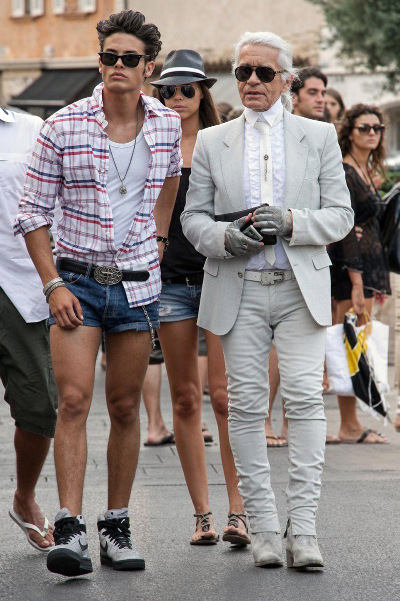 gaynostalgia1's tweet photo. Karl Lagerfeld walking in Saint-Tropez with model Baptiste Giabiconi. https://t.co/i69zNdPyCw