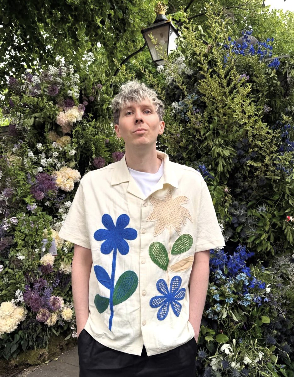theamazingphil's tweet photo. i still haven’t moved on from him dragging this sweater and now he’s dogging on the flower show shirt…. if i never see phil in either of these again the next top that gets slandered is dan howell himself https://t.co/8BwNPtDBjP