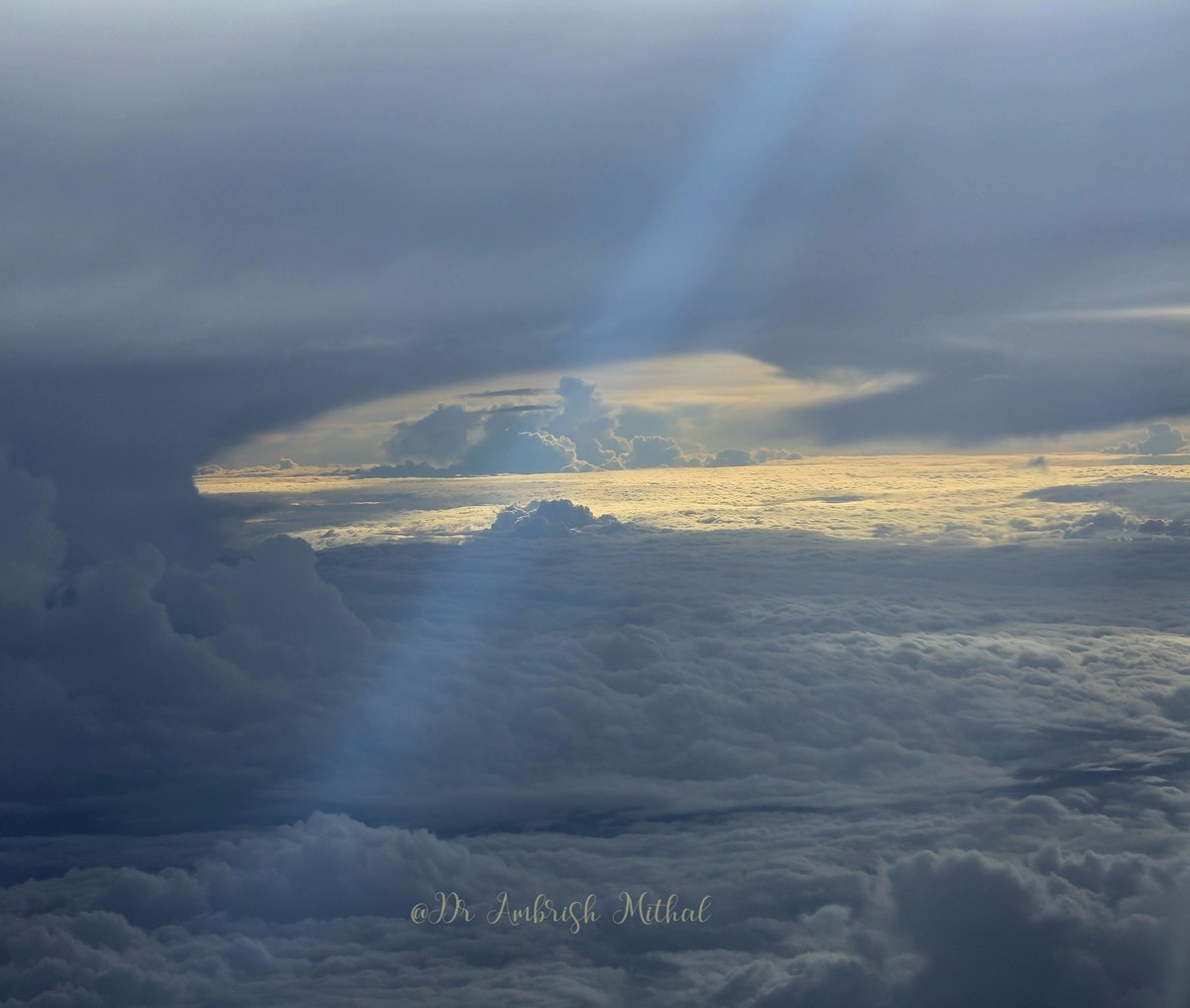 DrAmbrishMithal's tweet photo. Is it simply sunlight painting the clouds?
Or a glimpse of heaven?
#viewfromthewindow #airplane
#flight https://t.co/kvz89Y0mAP