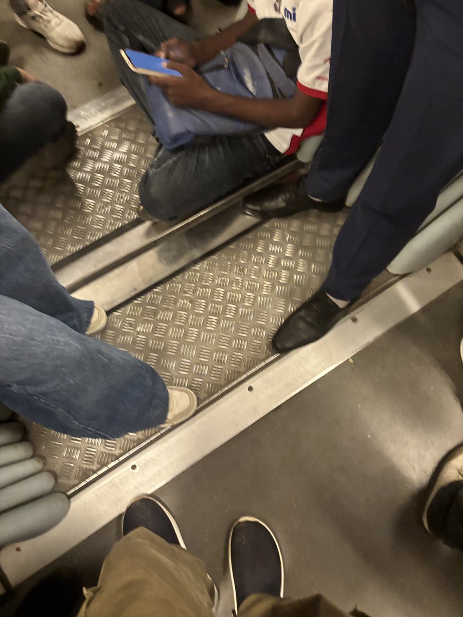 Loudlymute's tweet photo. @OfficialDMRC Sir I've been using metro since the yellow line started.Lately I've noticed a lot of ppl sitting on the floor.This lack of civil sense will grow further if something is not done, Request u 2 start announcing that sitting on floor is prohibited. https://t.co/QWG2vsL2GU