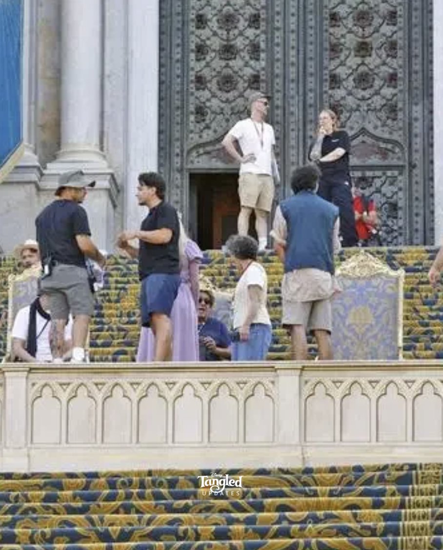 TangledUpdates's tweet photo. 🚨| NEW: Over 1000 extras are currently lined up in costume to film the live-action 'TANGLED' coronation scene in Spain!

Rapunzel's stand in actress is also seen wearing a full purple dress despite recent rumors. https://t.co/yCvQM3Hunc