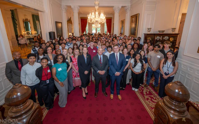 Group photo of interns from across state government with Governor Josh Stein and Secretary Denny in the Executive Mansion