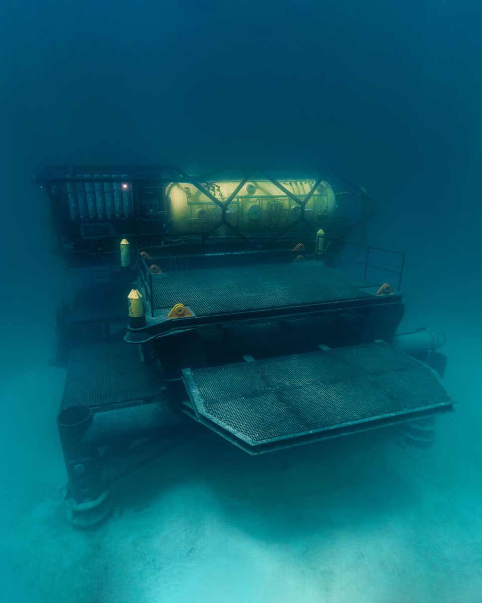 DeepEngineered's tweet photo. The journey down to Vanguard.

At Tennessee Reef, a yellow support buoy sits on the surface. It supplies air, communication, and other life support needs to the crews that will soon be living inside Vanguard. 

#DEEP #OceanExploration #Vanguard https://t.co/yiIZ8gA0S3