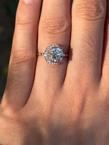 farhatkhan990's tweet photo. He said I'm his sun, his moon, and his stars when he proposed last weekend and I said yes while my brain screamed that I don't like this ring.
I feel like a horrible person even typing that. He's perfect, the proposal was perfect, I love him completely. But this ring feels too special, too unique for someone like me who wears the same three plain shirts on rotation and panics when people look at me too long.
He got it from a talented jeweler he found through the Tedooo app, someone I'd actually been following for over a year without him knowing. Which should make it more meaningful but instead makes me feel worse because he clearly put so much thought into this.
It's beautiful. Everyone says it's stunning. My friends are posting my hand all over social media while I smile and pretend I'm not already thinking about how I'll explain wanting to exchange it. I don't like standing out and this ring demands attention everywhere I go.
Should I get used to it? Tell him the truth? I don't want to ruin his gesture but I also don't want to wear something that makes me uncomfortable for the rest of my life.
